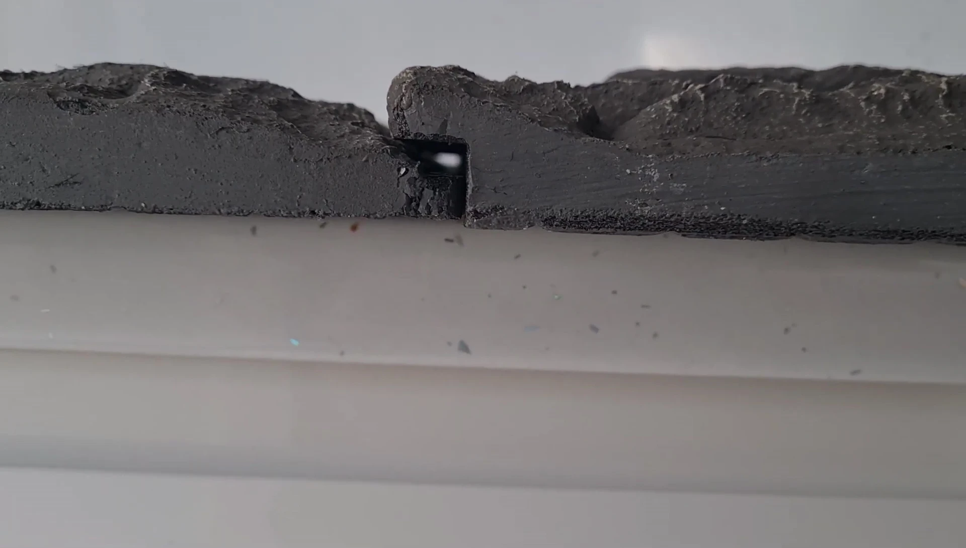 Close up showing the imperfect fit of the panels