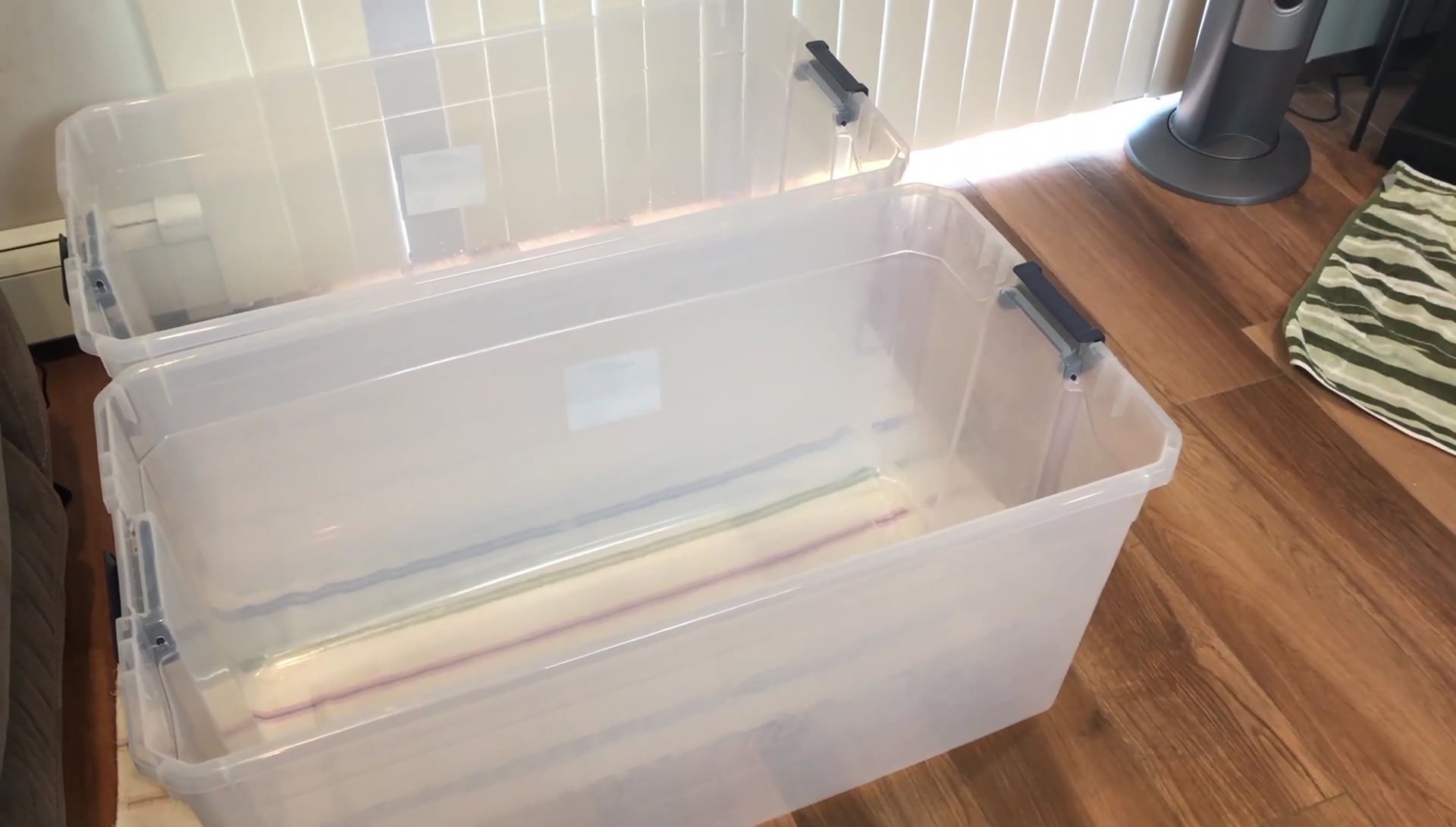 Two 50-gallon totes used for temporary fish housing.