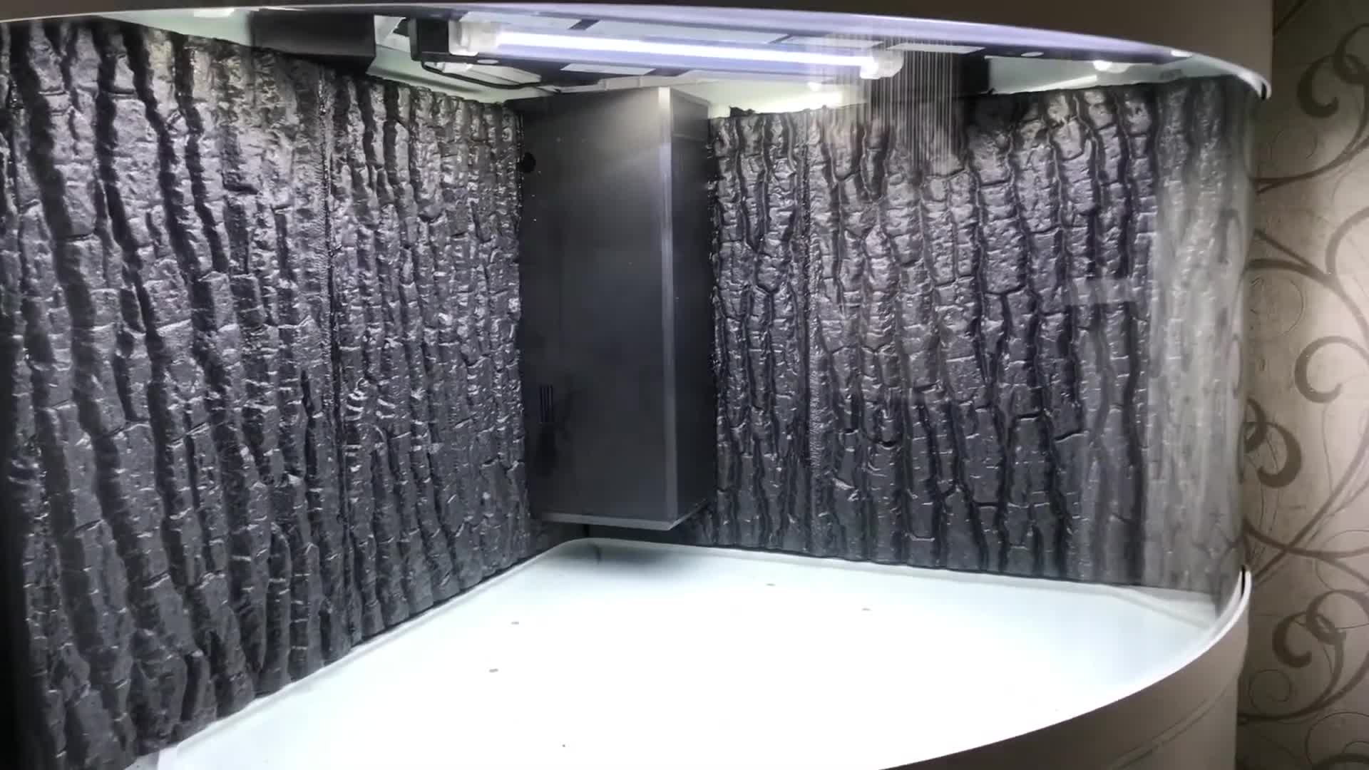 Close-up of the Juwel Trigon 350 3D background being installed
