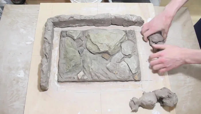 Optionally, create a second, larger clay barrier around the alginate mold (1 inch larger on all sides).