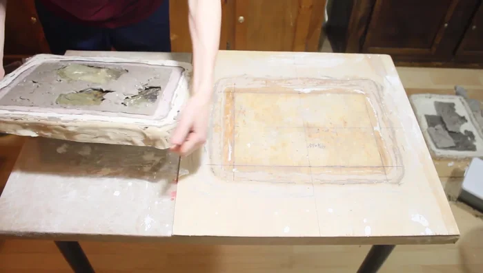 Remove the clay barrier. Flip the form and remove the alginate mold. Clean excess clay from the mold and place it back into the plaster mold.