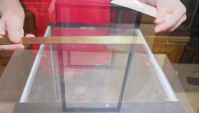 Measure your aquarium and draw a box on plywood, slightly smaller than the actual dimensions.