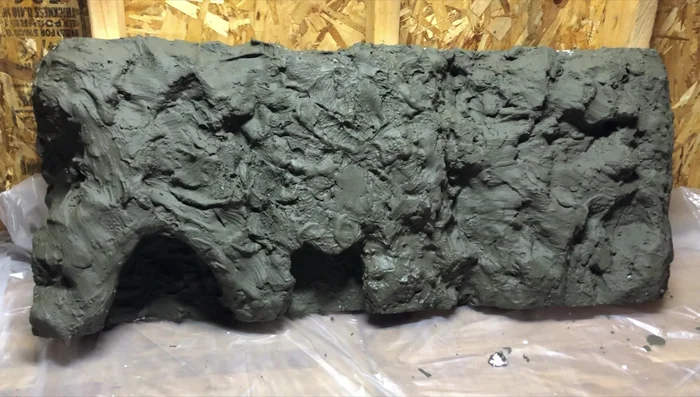 Allow the concrete mix to cure completely (24 hours). Once cured, the background will be extremely hard and durable, suitable for submersion in the aquarium.