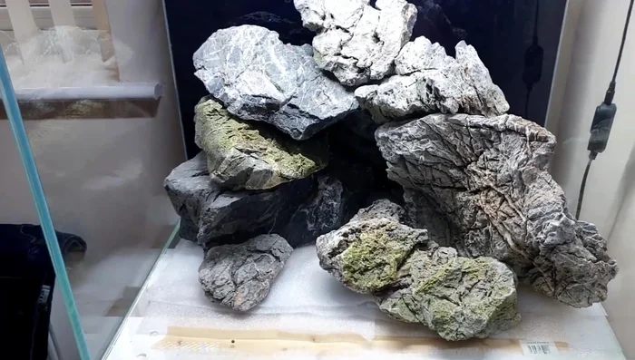 Add sand and gravel to fill in gaps and create a natural look.