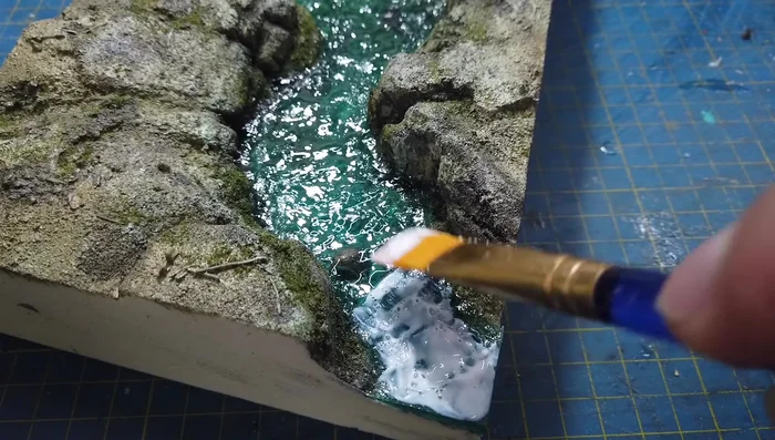 Adding white water using Vallejo foam and snow texture.