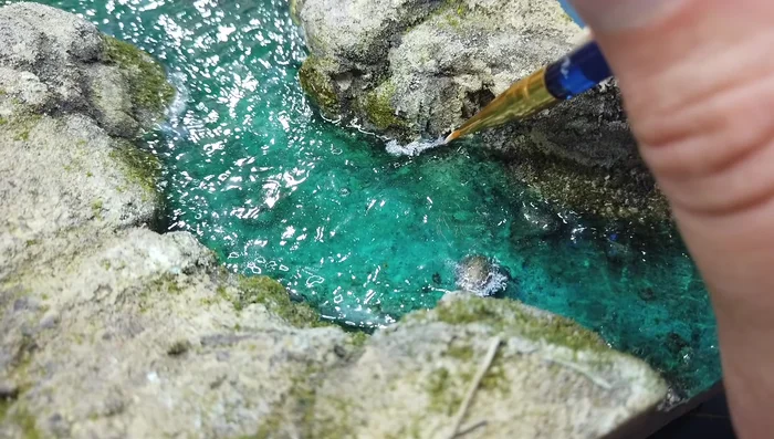 Adding white water using Vallejo foam and snow texture.