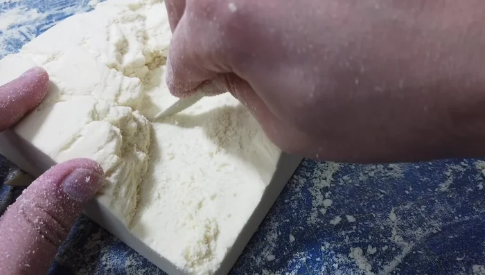 Tidying the riverbed using a table knife.