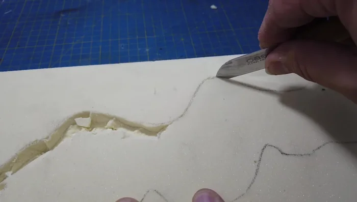 Tidying the riverbed using a table knife.