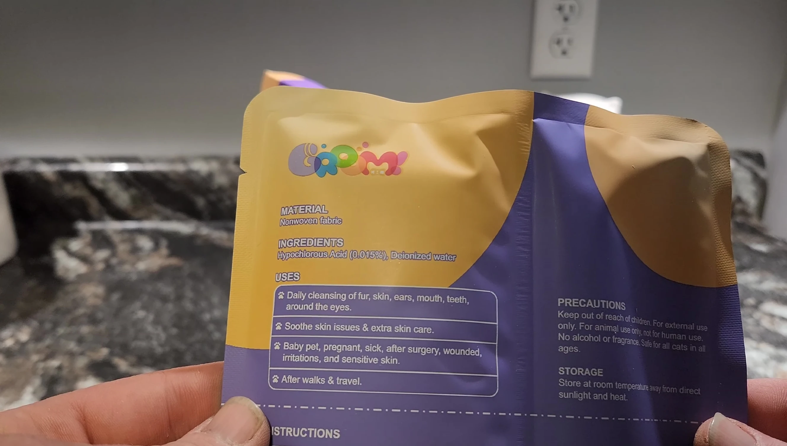 Demonstration of opening the package and the glove absorbing the liquid.