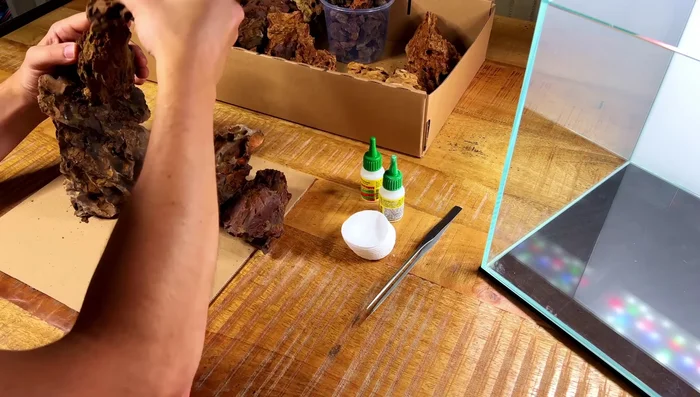 Test fit the hardscape inside the aquarium to check placement.