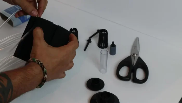 Cut and connect the air tubing: Measure and cut the air tubing. Connect one end to the air stone.