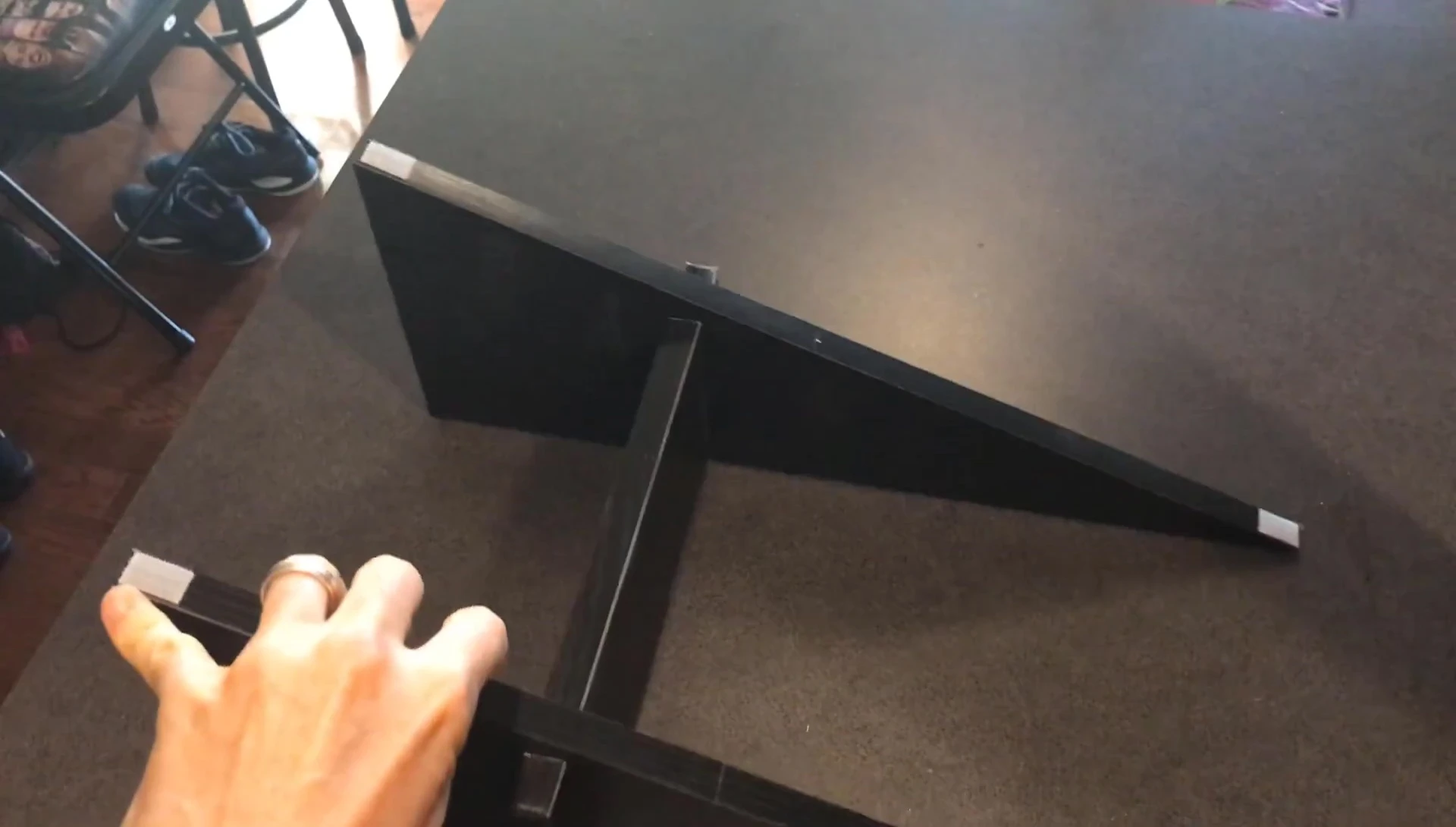 Highlighting the reversible scratching pad.