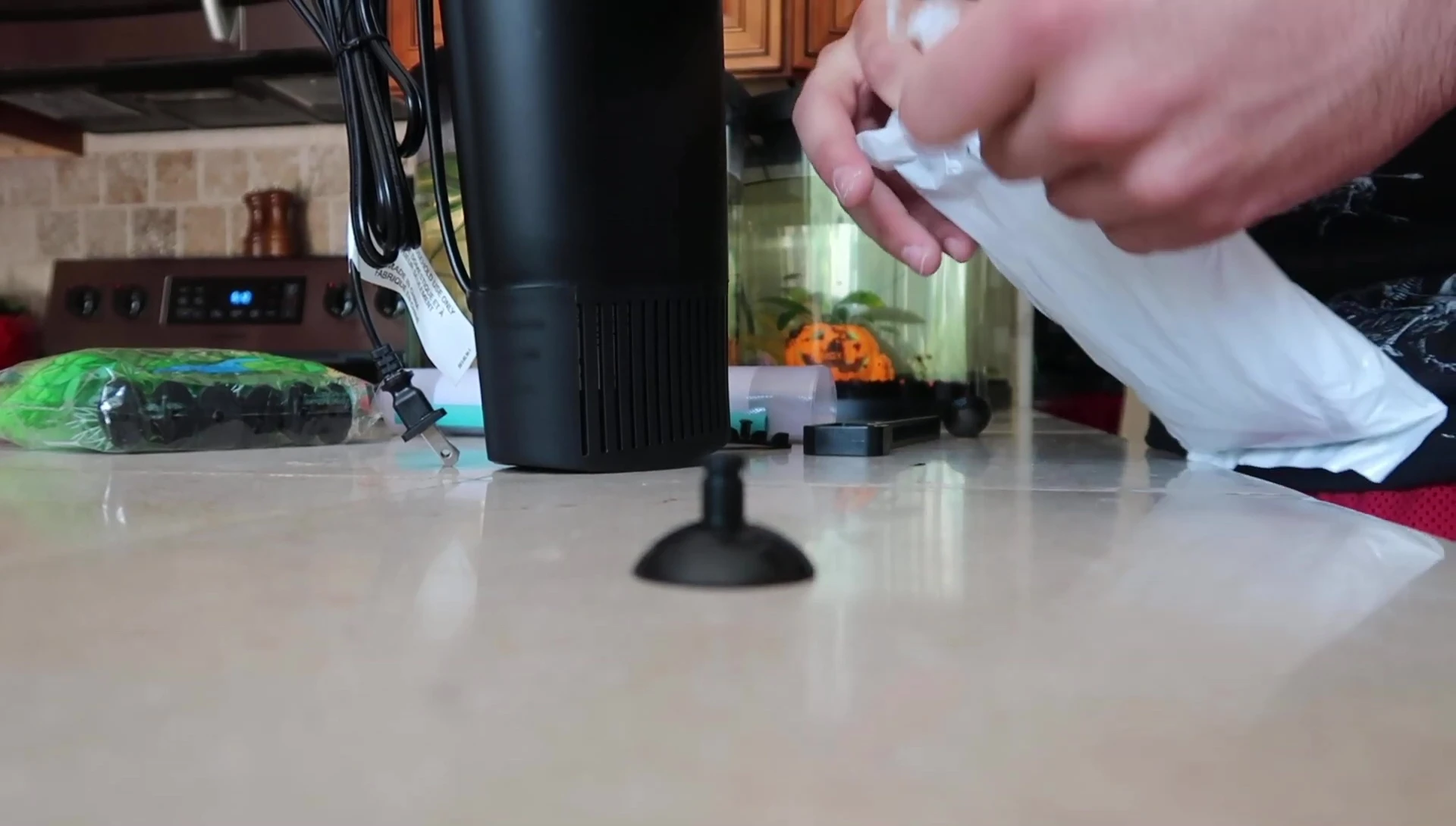 The narrator is using the old filter cartridge in the new filter