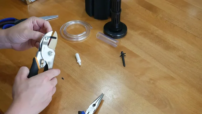Insert a piece of airline tubing into the cut end of the plastic piece. Attach a small air stone to the other end of the tubing.
