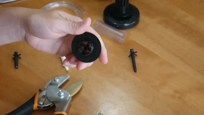 Insert a piece of airline tubing into the cut end of the plastic piece. Attach a small air stone to the other end of the tubing.