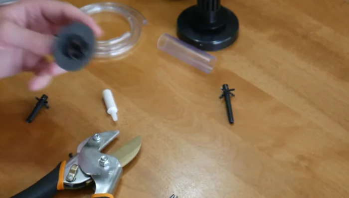 Insert a piece of airline tubing into the cut end of the plastic piece. Attach a small air stone to the other end of the tubing.