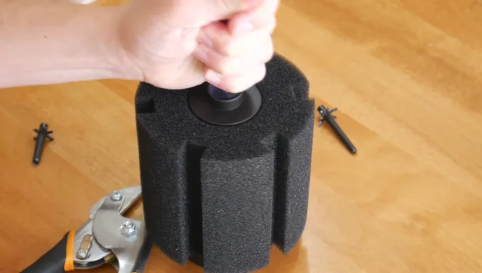 Attach the clear tube to the airline and fasten it into place.