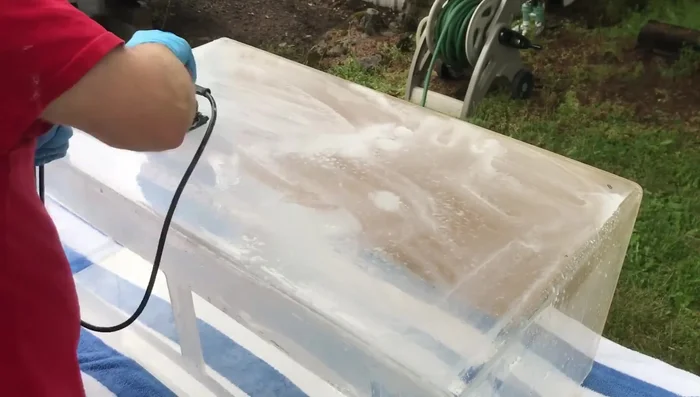 Wet sand the outside of the aquarium with 1000 grit sandpaper, then 2000 grit sandpaper. Keep the acrylic wet.