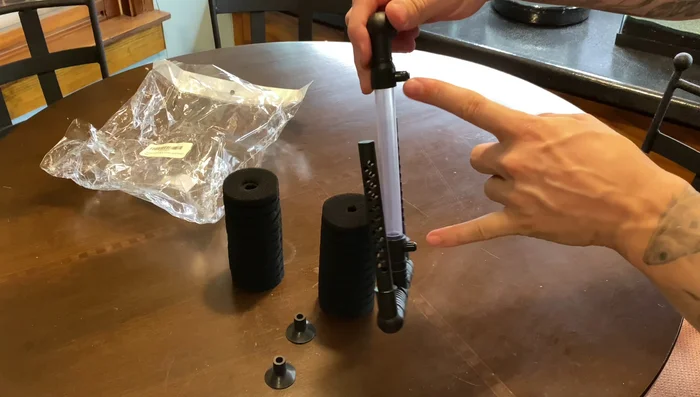 Attach the suction cups to the filter's niblets.