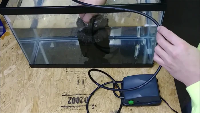 Place the filter in the aquarium; gently squeeze the air out of the filter sponge to ensure it sinks to the bottom.