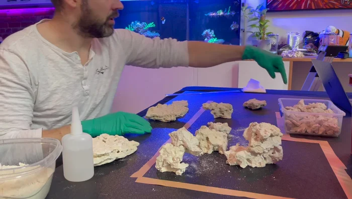 Plan Your Scape: Mark out the usable section of your tank with tape, considering the existing rockscape and overflow box. Visualize the placement of your new scape.