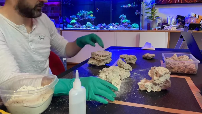 Build the Structure: Continue gluing pieces together using the same method, paying attention to create voids and negative space for a visually appealing scape. Use time-lapse for larger structures. Note: It will get hot!