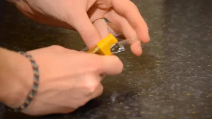 Hold the melted ends together for about 30 seconds until they solidify.