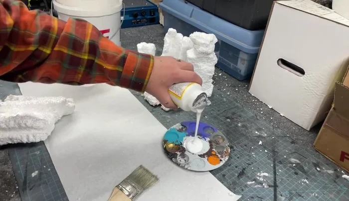 Apply Mod Podge to the foam structures.