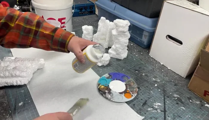 Use a wet brush to smooth and blend the sand, creating a more natural texture.