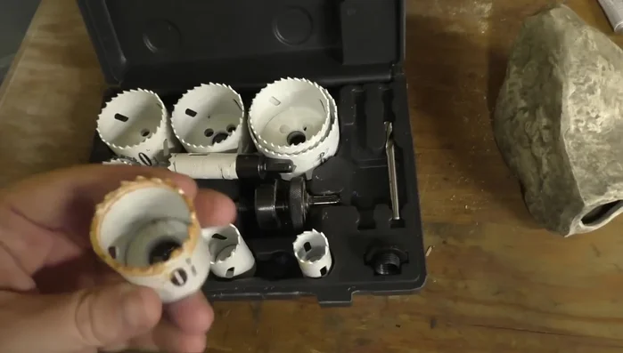 Choose a hole saw bit from your kit. A smaller bit is recommended for smaller fish.