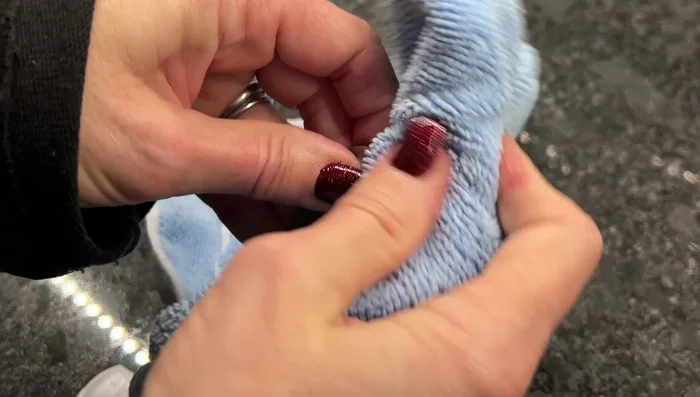 Clean the blade with a microfiber towel. Wipe the blade clean after brushing.