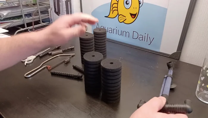 Prepare additional uprights. Use spare filter parts to create additional vertical supports for the sponges. The video uses parts from a spare filter.