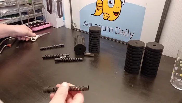 Extend the uprights. Cut pieces of thick tubing to extend the filter's height. Attach these extensions to the existing filter uprights to support the extra sponges.