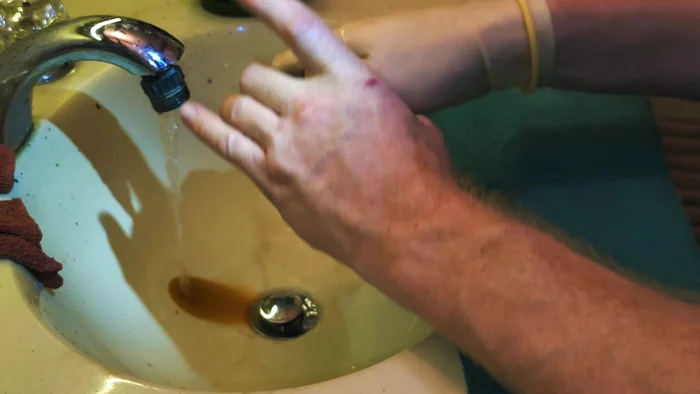 Clean the filter base and attachments: If using the scouring pad, use it on the base of the filter. If a zip tie/PVC is used for weight, clean the added component as well.