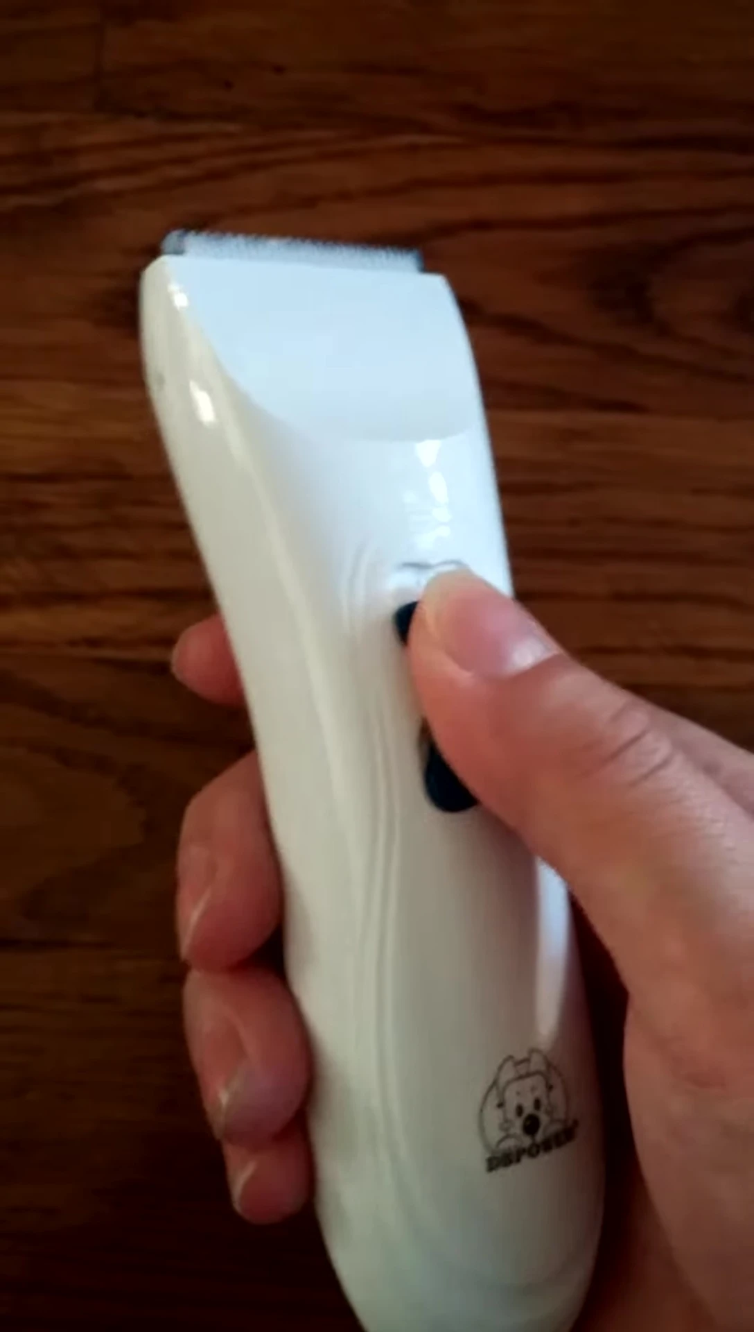 A final shot of the user holding the trimmer, showing satisfaction.