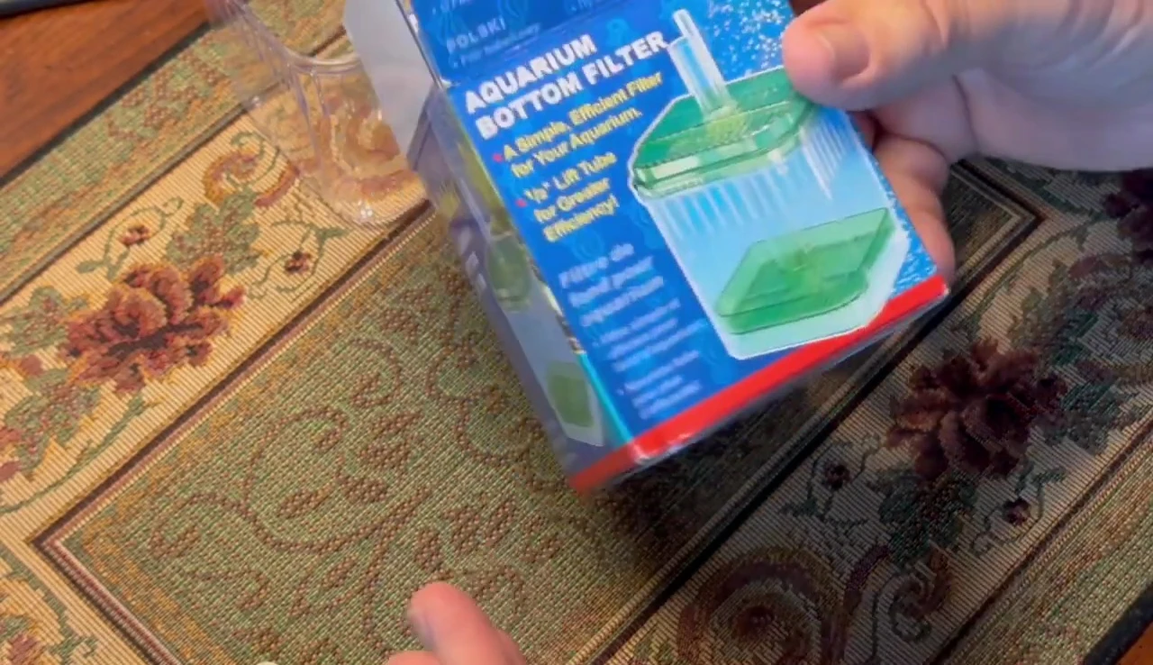 A box filter shown in a small aquarium.