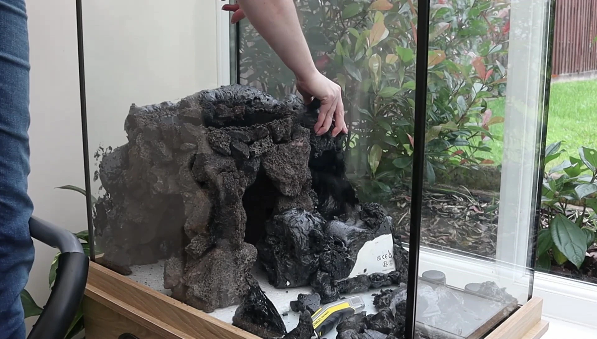 Close-up of expanding foam being used to create the cave structure.