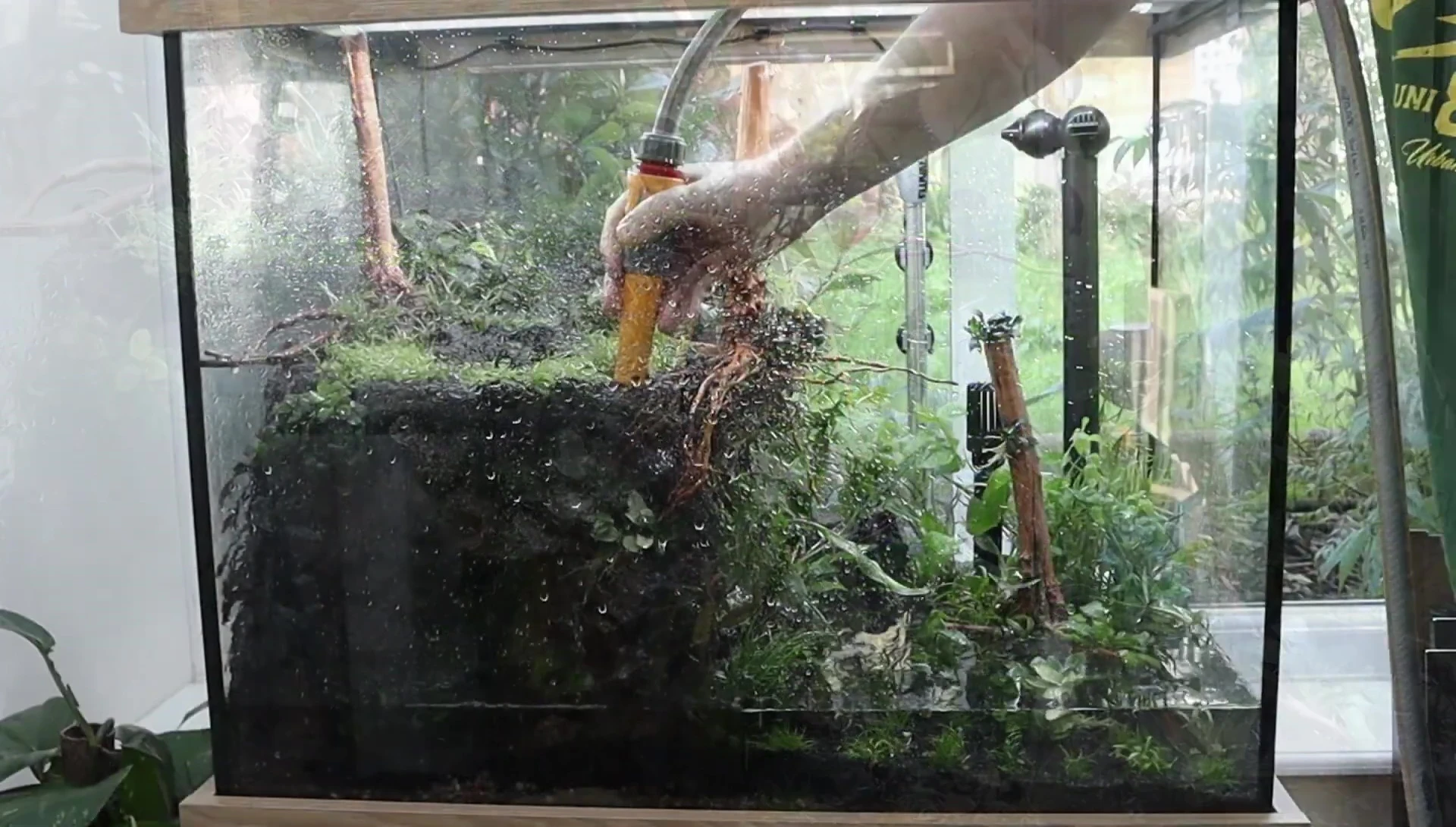 The tank being filled with water.