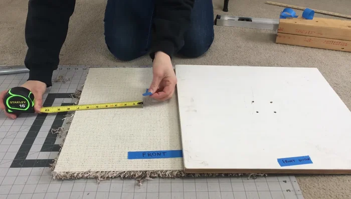 Cut a hole in the carpet for the post to fit through, ensuring proper centering.