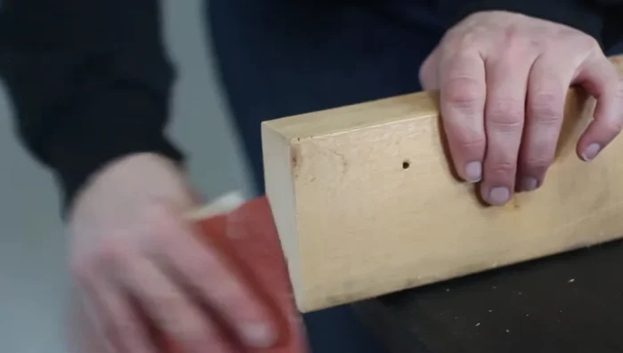 Tape and screw the two two-by-fours together to create a sturdy post.