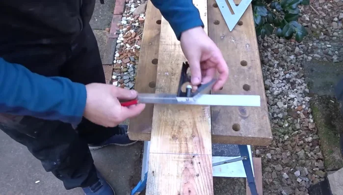 Attach the top: Attach the top piece to the post using screws, ensuring it's centered. Apply linseed oil to protect the wood.