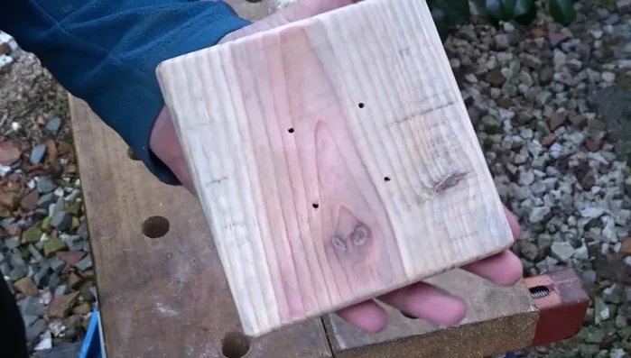 Attach the top: Attach the top piece to the post using screws, ensuring it's centered. Apply linseed oil to protect the wood.