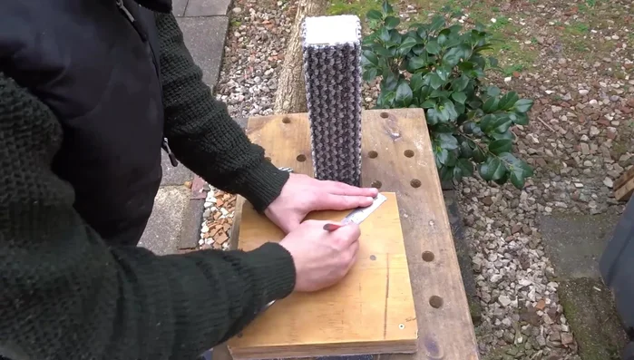 Final touches: Apply a coat of linseed oil to the base edges and buff off the excess.