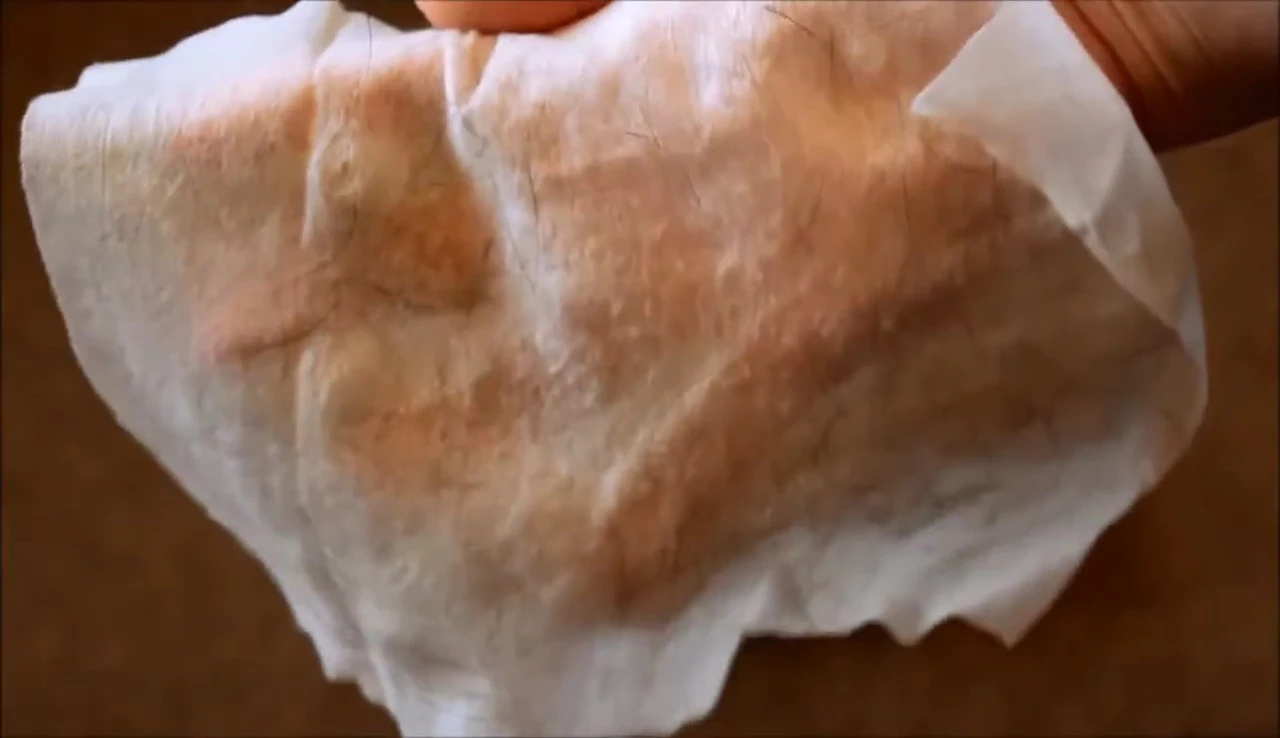Close-up showing the thinness of Earthbath wipes and dirt removed