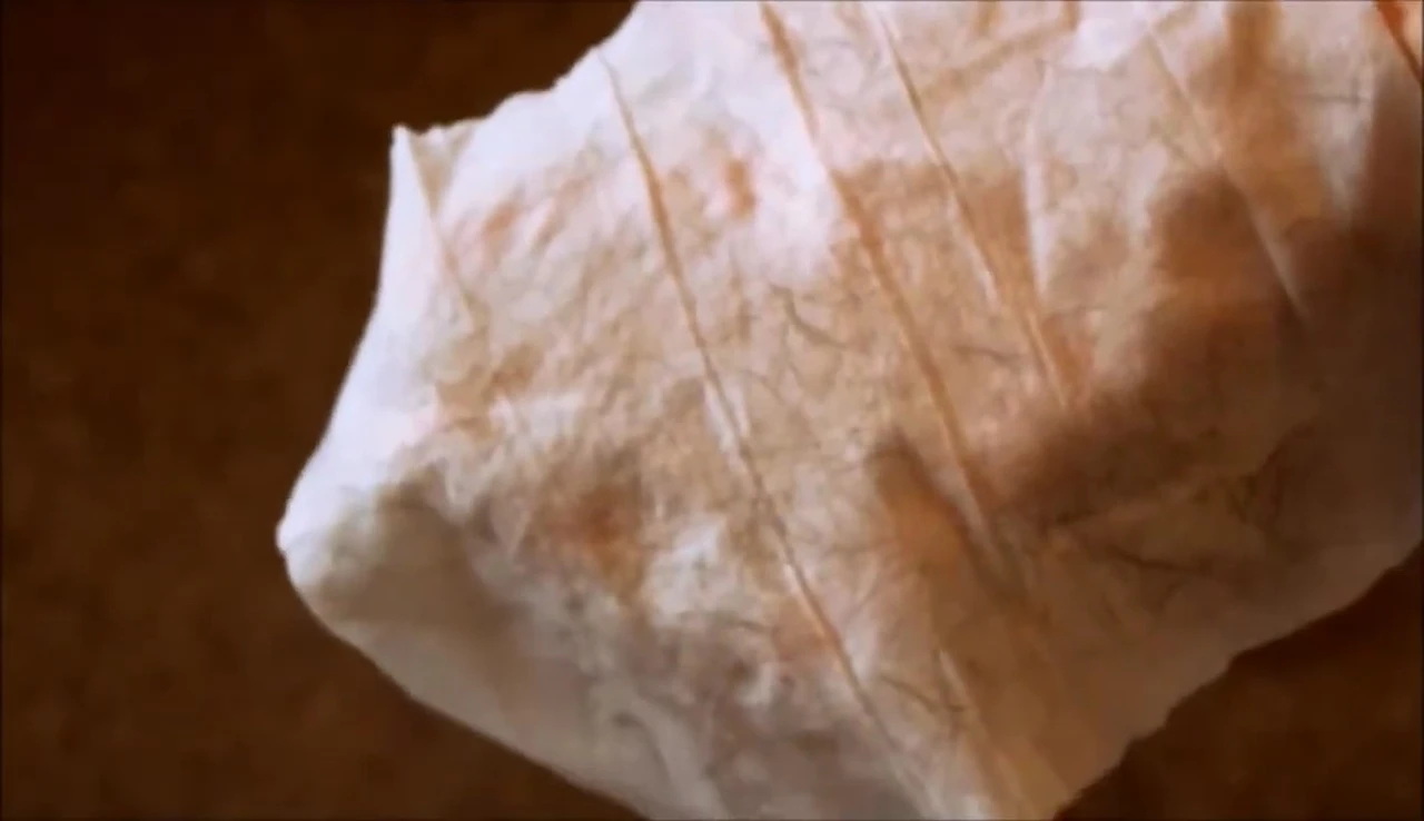 Close-up of Nature's Miracle wipe showing dirt removed