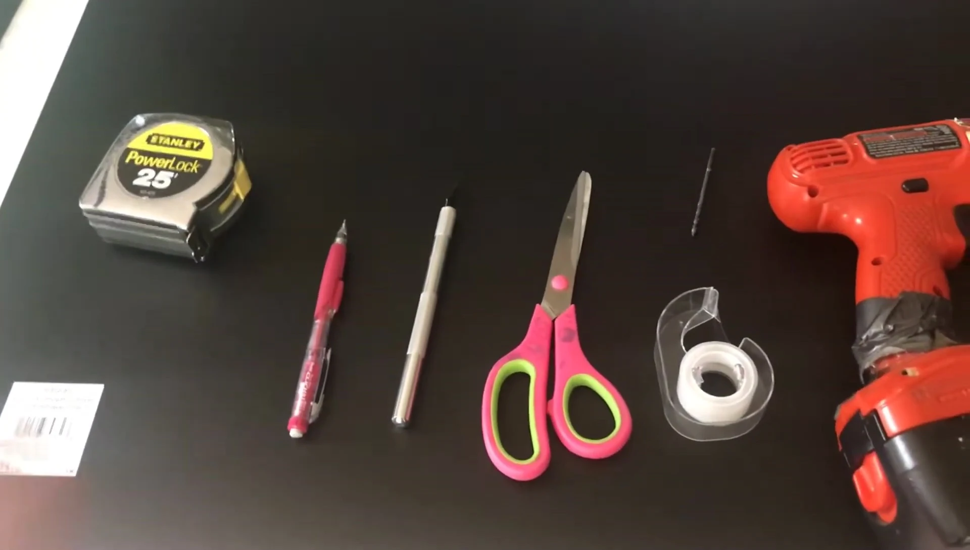 Image showing the corrugated plastic sheet, measuring tape, pencil, exacto knife, scissors, tape, drill bit, and drill.