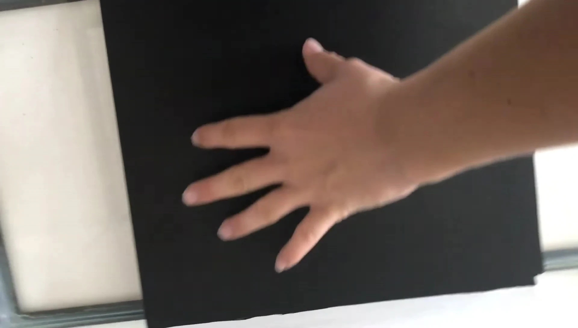 Tracing the divider onto the plastic sheet.