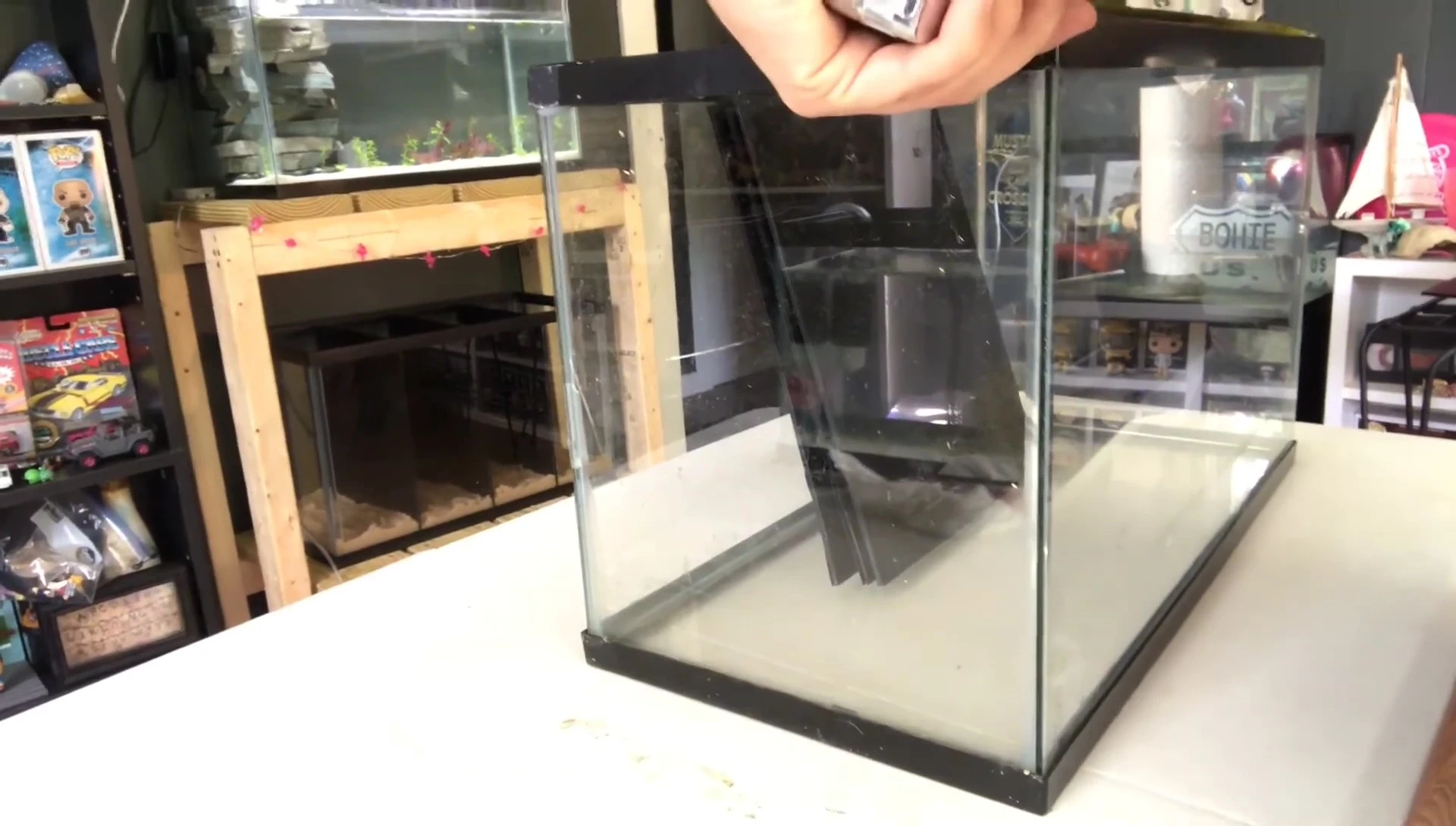 Measuring and marking placement of dividers in the tank.