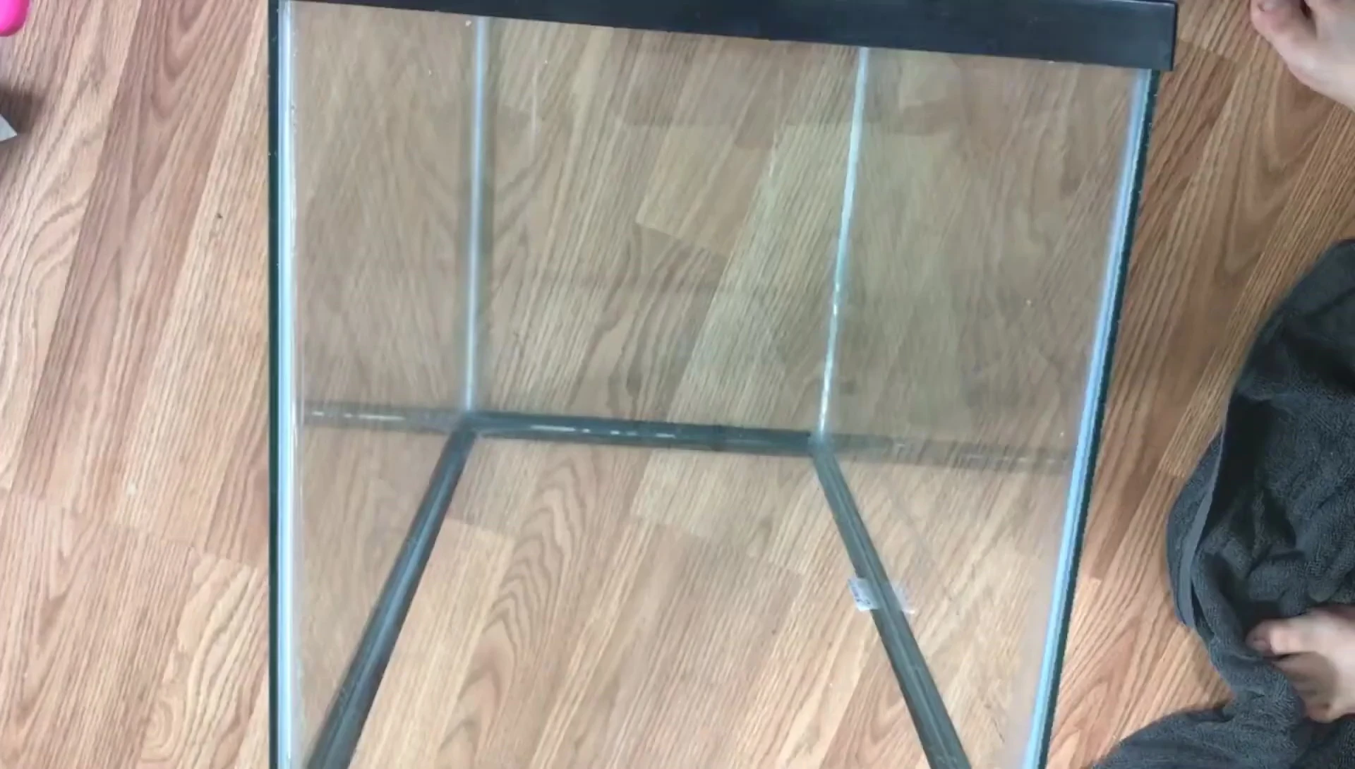 Measuring the inside width of the aquarium.
