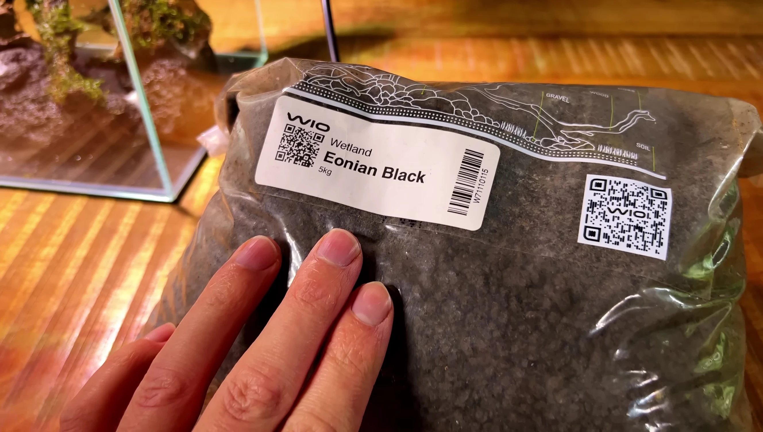 Adding the crushed black lava rock substrate.